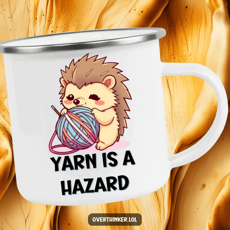 Funny Kawaii hedgehog camping mug featuring a flustered character tangled in yarn, perfect for outdoor enthusiasts who enjoy crafting humor.