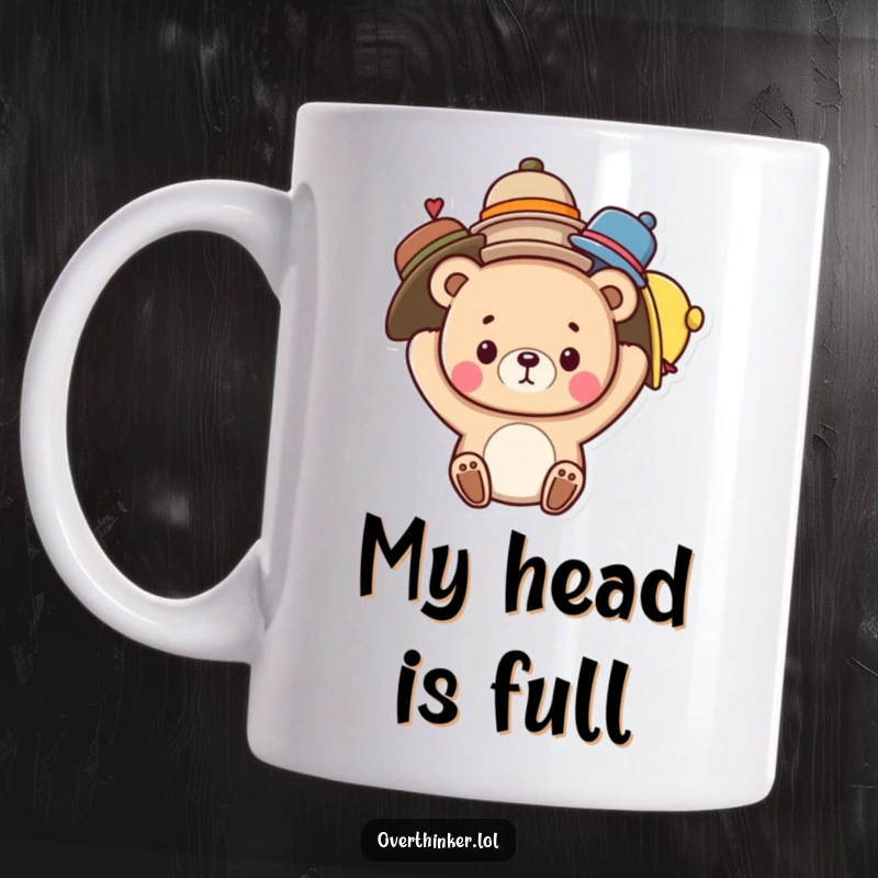 Funny mug with a cute bear character comically balancing an excessive amount of hats on its head, showcasing a relatable juggling act.