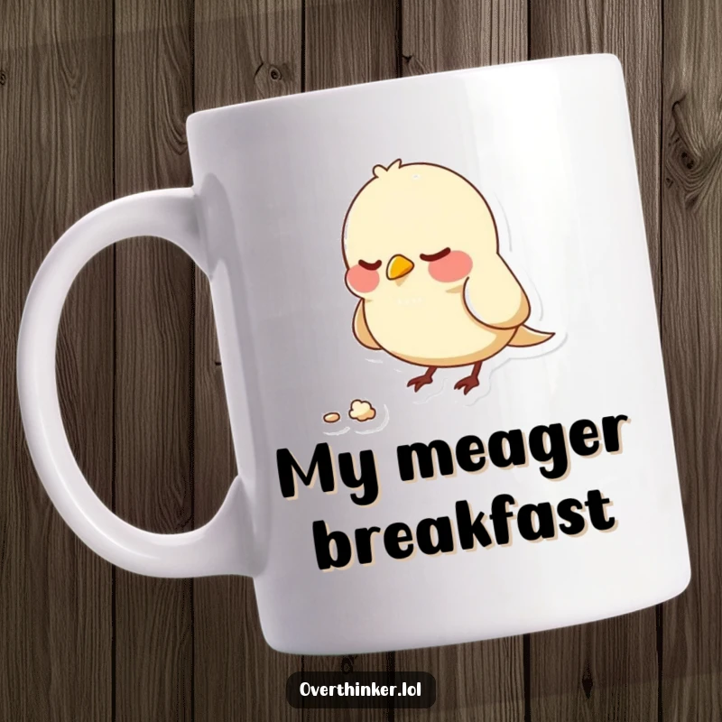 Funny mug showing a small bird character nervously pecking at a single, unmoving crumb, conveying anxiety and overthinking.