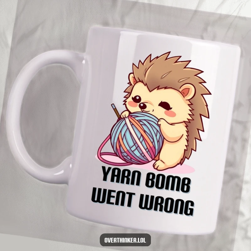 Funny Kawaii hedgehog mug showing a flustered character tangled in a ball of yarn, representing crafting struggles with adorable humor.