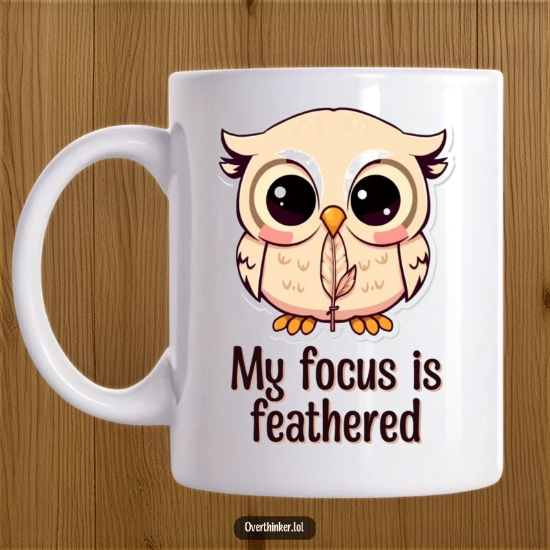 Funny Kawaii owl mug with large pupils staring intensely at a single feather, conveying deep concentration and humor.