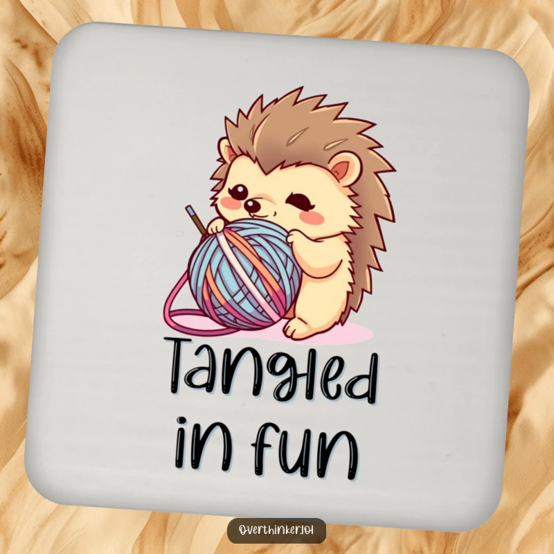 Funny Kawaii hedgehog drink coaster showcasing a flustered character entangled in yarn, offering humorous protection for surfaces.