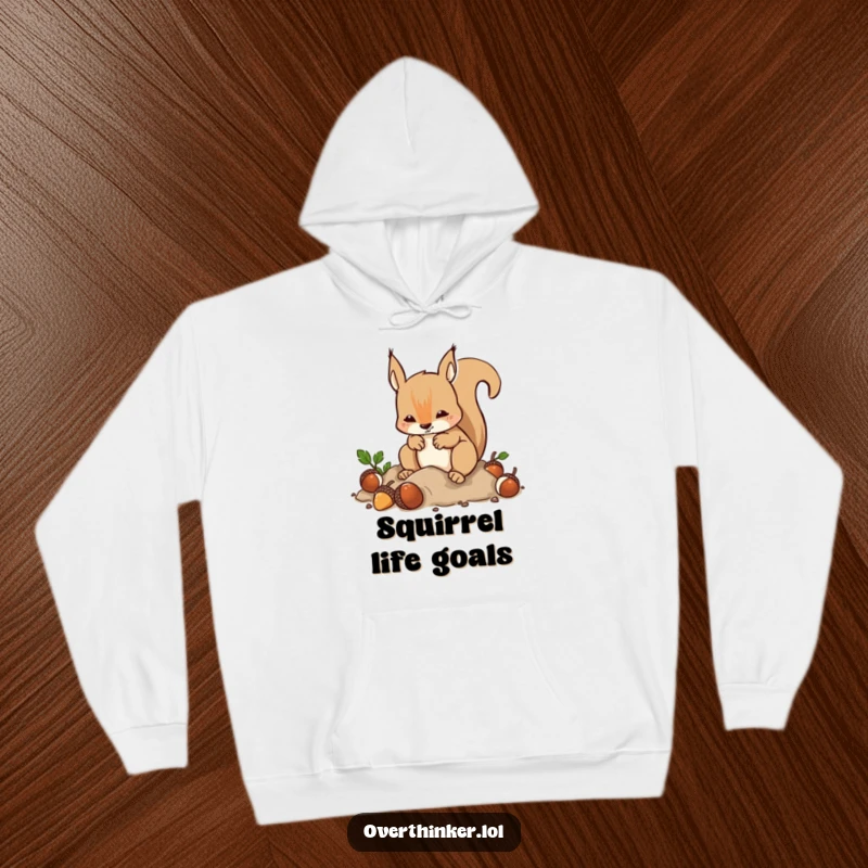 Funny Hoodie: A squirrel's frantic acorn burying and digging is humorously depicted, perfect for embracing anxious comfort.