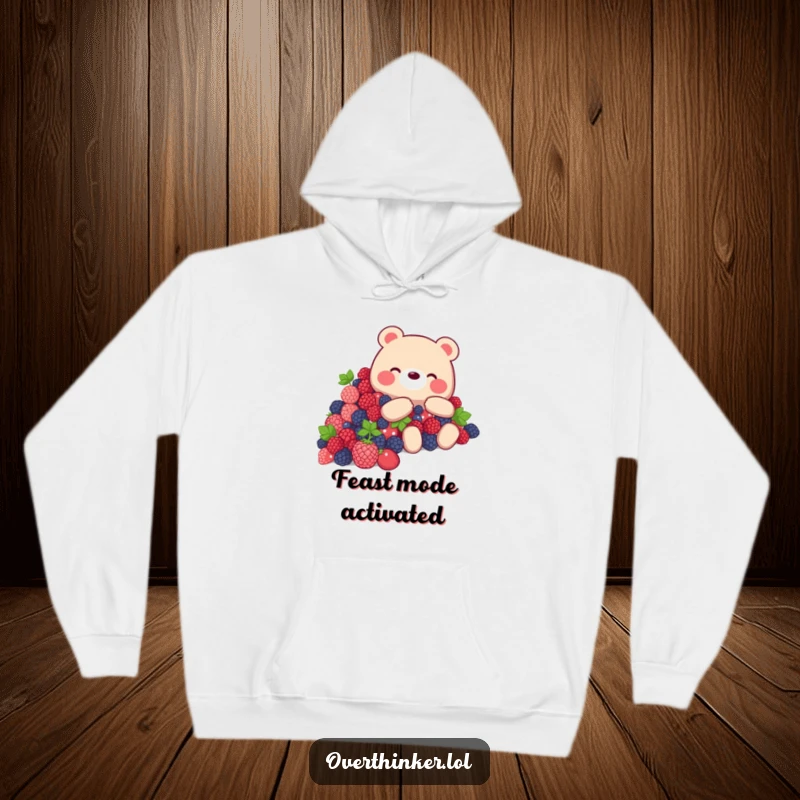 Funny Bear Hoodie depicting a bear looking overwhelmed by a mountain of delicious berries, a humorous garment.