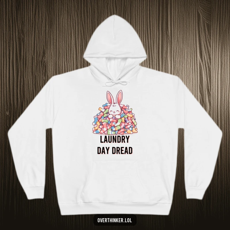 Funny rabbit hoodie showing a rabbit looking bewildered amidst a massive heap of unmatched socks, perfect for cozy, humorous lounging.