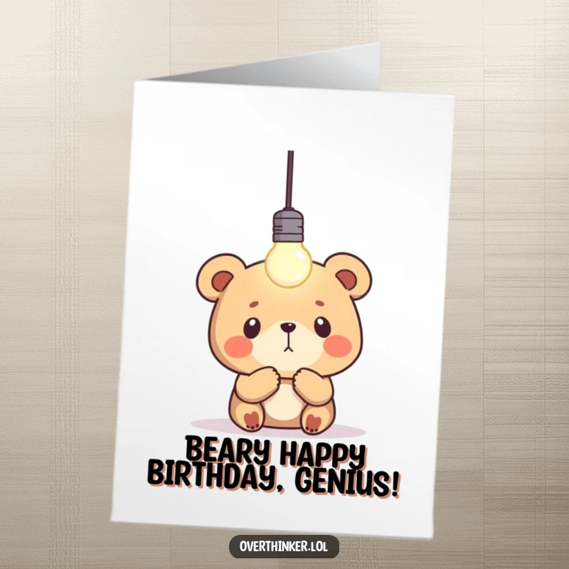 Funny Free Printable Birthday Card: Bear character gazes at a blinking lightbulb, a lightbulb icon above his head. Downloadable art.
