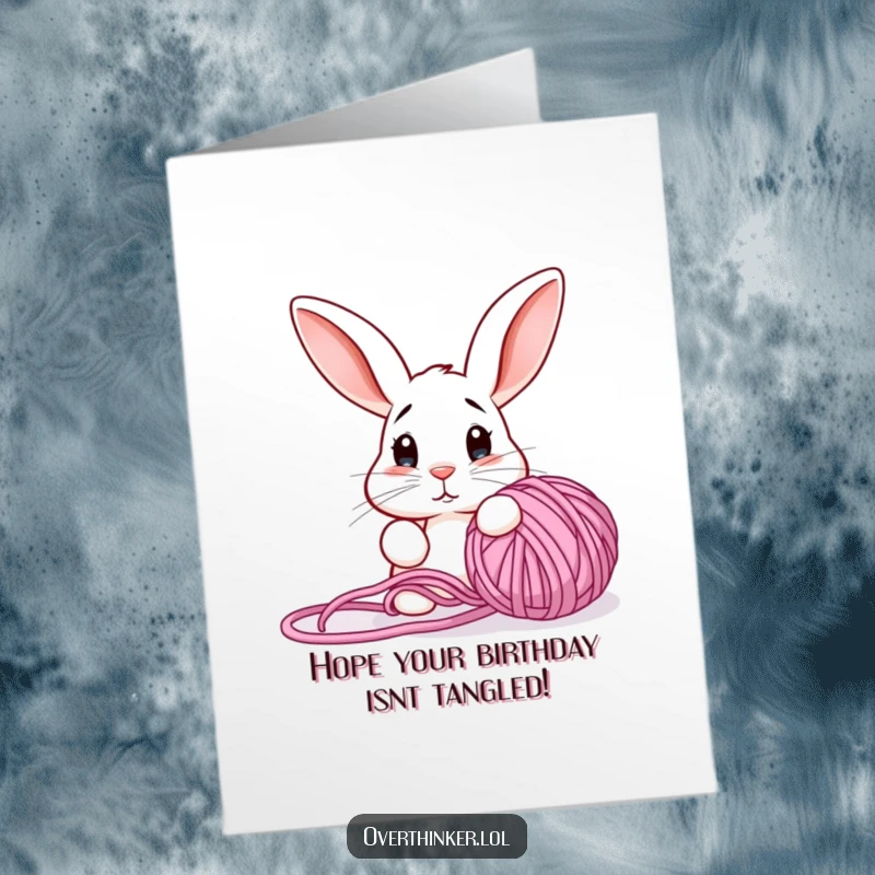 Funny Free Printable Birthday Card: Confused rabbit stares at a large tangled yarn ball, ears perked, a humorous birthday puzzle.