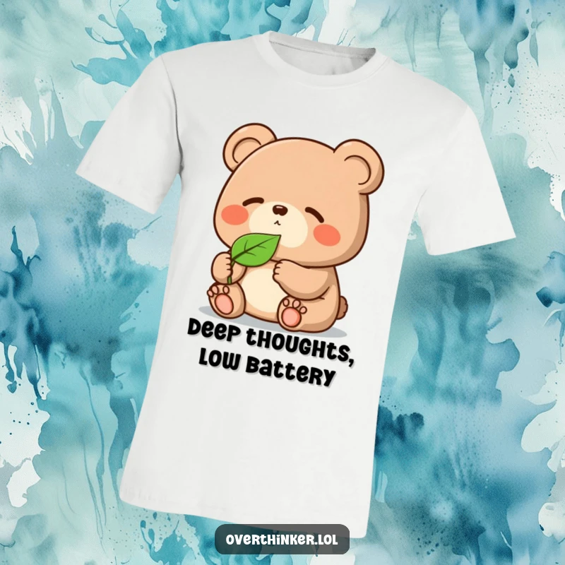 Funny Kawaii bear t-shirt, a cute character deeply pondering a single floating leaf with exaggerated focus and humor.
