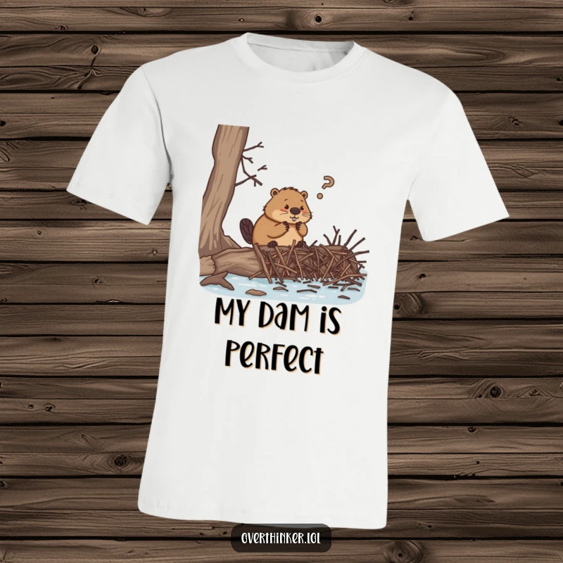 Funny t-shirt, an overthinking beaver struggling to build a dam with an impossible amount of tiny twigs, depicting relatable stress.