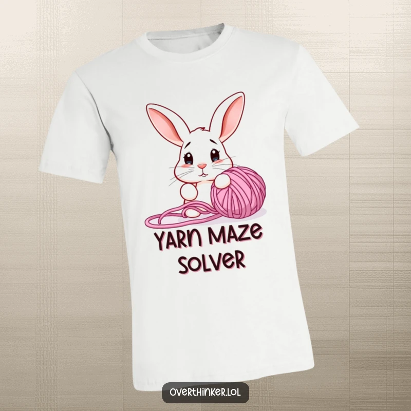 Funny t-shirt showcasing a bewildered rabbit with alert ears fixated on a chaotic tangle of yarn, symbolizing craft chaos.