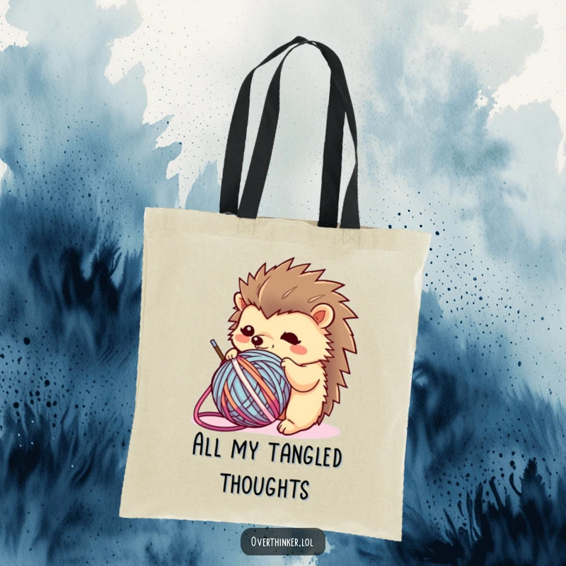 Funny Kawaii hedgehog tote bag showing a flustered character caught in a ball of yarn, perfect for carrying supplies with a humorous twist.