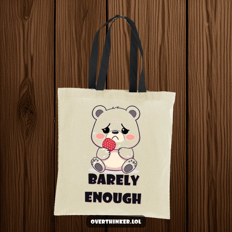 Funny tote bag with a grumpy bear holding a single tiny berry, great for everyday use.