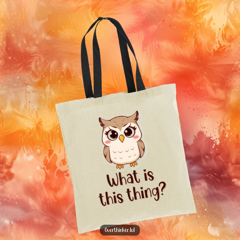 Funny Owl Tote Bag showcasing a small owl character with wide, questioning eyes and a furrowed brow, ready to go. Useful and funny.